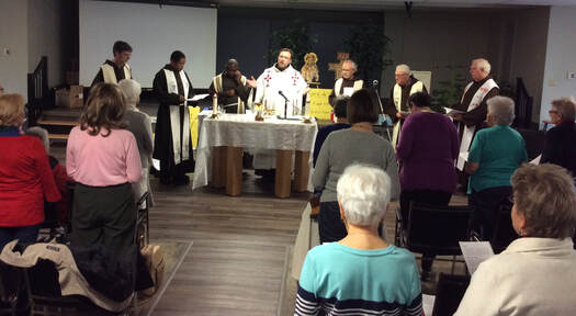 Participating in Eucharistic celebration at Fraternite 2019